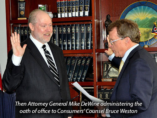 Then Attorney General Mike DeWine administering the oath of office to Consumers' Counsel Bruce Weston