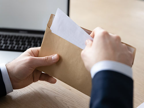 Putting a letter in an envelope