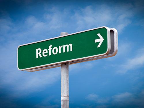 A street sign that says reform